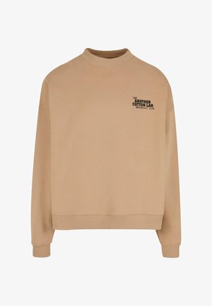Beige cotton sweatshirt with a high neckline, long sleeves, and ribbed cuffs. Features "THE ANOTHER COTTON LAB BREAKFAST CLUB" in black print.