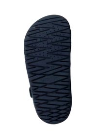 Suela de zapato de goma negra con un patrón texturizado en zigzag y agujeros de drenaje. Presenta el nombre de la marca "GEOX" y la talla "27" grabados.