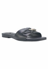 Black leather slide sandal featuring a curved toe design, a prominent metallic buckle accent, and a flat sole for comfort.