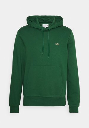 Sweat à capuche vert avec poche avant, cordons, poignets côtelés et petit logo crocodile brodé sur la poitrine.