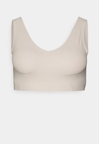 Beige avskåret bralette med vid V-hals og tykke stropper, laget av mykt, elastisk materiale med glatt tekstur og sømløst design.