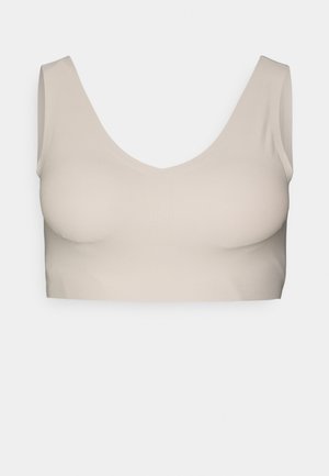 Beige cropped bralette with a wide V-neck and thick straps, made of soft, stretchy material, smooth texture, and seamless design.