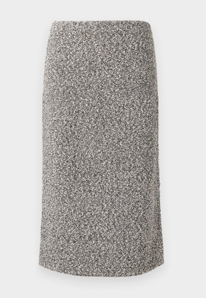 Fustă până la genunchi dintr-un material texturat, cu un model cu flicuri alb-negru. Croi drept, cu talie elastică.