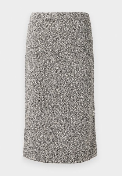 Fustă până la genunchi dintr-un material texturat, cu un model cu flicuri alb-negru. Croi drept, cu talie elastică.