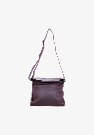 Purple leather crossbody bag with a foldover top, adjustable strap, and front pocket. Smooth texture and simple design with no visible hardware.