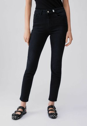 HIGH-RISE - Jeans Tapered Fit - black