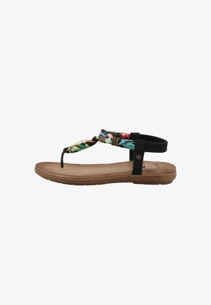 Sandalia plana con suela de goma marrón, correas negras y empeine con un colorido patrón floral y detalles trenzados.