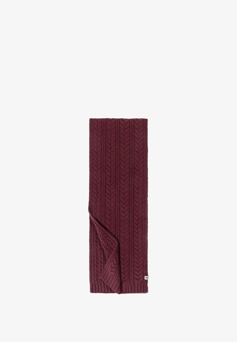 Burgundy knit scarf featuring a textured chevron pattern with a folded edge and a small white brand label sewn into the corner.