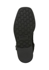 Soletta in gomma nera con pattern di grip testurizzato e tallone liscio. Presenta un'impronta del logo e una forma della punta arrotondata, progettata per la stabilità.