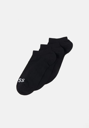 Chaussettes noires mi-mollet, en mélange de coton, avec une texture côtelée. Inclut une paire avec un petit logo blanc sur le côté.