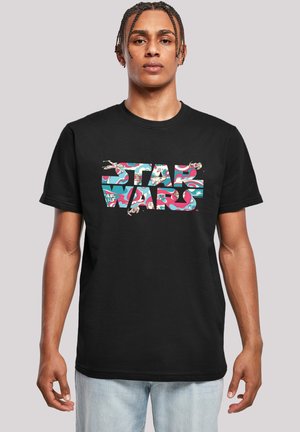 Svart bomullst-skjorte med et flerfarget "STAR WARS"-grafikk med et virvlende mønster og illustrasjoner av romskip. Standard passform.
