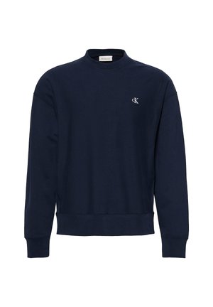 Navy blue long-sleeve sweatshirt with crew neck, ribbed cuffs and hem, and small white "cK" logo on left chest.