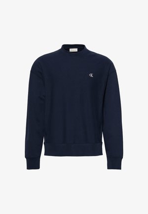 Navy blue long-sleeve sweatshirt with crew neck, ribbed cuffs and hem, and small white "cK" logo on left chest.
