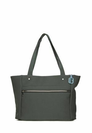 Gray tote bag made of soft fabric, featuring two long handles, a front zip pocket, and a small blue tag on the side.
