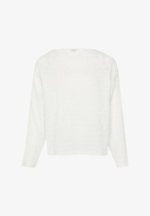 Dolga bela majica z teksturiranim mrežastim vzorcem, krojenjem okroglega izreza ter sproščenim fitom. Narejena je iz lahkega materiala, primerna za vsakodnevno nošenje.