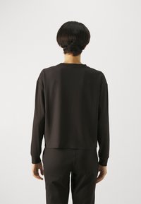 Puma Långärmad tröja - black