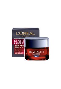 Crème de nuit anti-âge Revitalift Laser X3 de L'Oréal dans un pot en verre rond avec un couvercle argenté et une base rouge foncé, emballée dans une boîte noire.