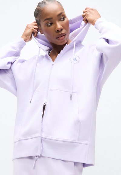 Levanduľová mikina na zips s predným zipsom, dvoma bočnými vreckami, nastaviteľnou kapucňou a malým logom na hrudi. Hladká textúra látky.