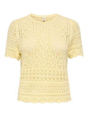 Gul kortermet strikket topp med intrikate blonediagrammer og bølgete kanter langs ermer og kant.