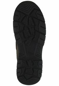 Suola di calzature in gomma nera con scanalature profonde e motivi a zigzag, progettata per resistenza e aderenza su varie superfici.