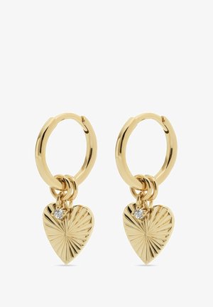 Orecchini a cerchio in oro con un charm a forma di cuore testurizzato, caratterizzati da un motivo a raggiera e un piccolo dettaglio in gemma trasparente.