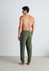 Tommy Hilfiger TRACK - Pyjama bottoms - utility olive