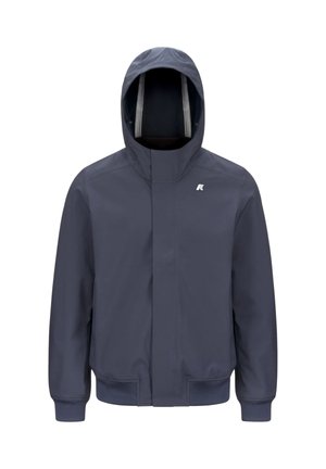 Veste imperméable à capuche bleu marine avec fermeture éclair frontale, poignets élastiques et petit logo blanc sur le côté gauche de la poitrine.