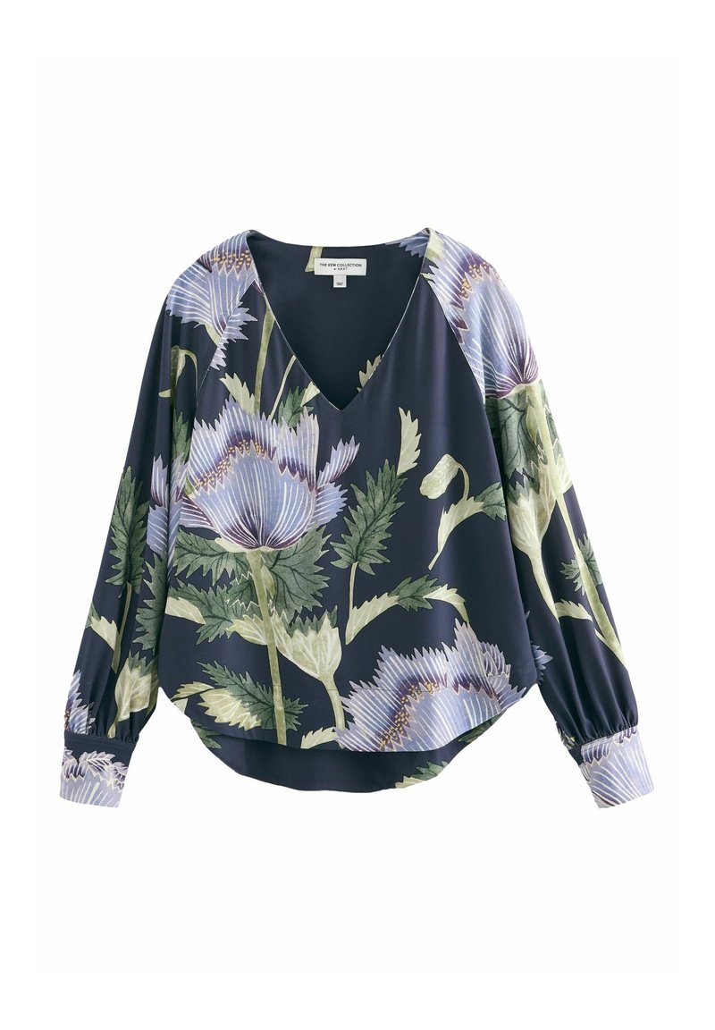 Blouse bleu foncé à manches longues avec col en V et grand imprimé floral violet clair et vert, avec des poignets froncés et une coupe ample.