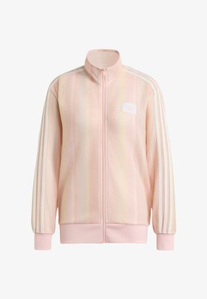 Light pink full-zip jacket with ribbed texture, three white stripes on sleeves, ribbed cuffs and hem, and a small logo patch on the chest.