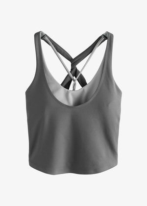 Gray athletic crop top with cross-back straps, made of smooth fabric. Features a rounded neckline and a fitted silhouette.