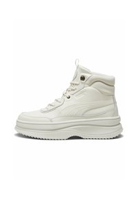 High-top sneakers in white synthetic leather with a textured finish, featuring tonal laces, padded collar, and a thick, ridged rubber sole.
