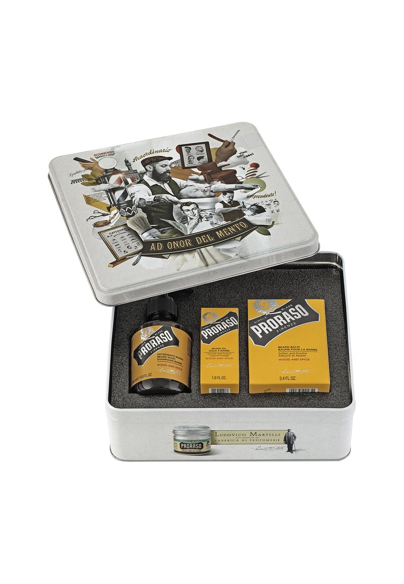 Boîte-cadeau en fer blanc avec un design vintage ; contient de l'huile à barbe, du baume et du savon dans un emballage jaune, avec une illustration en noir et blanc sur le couvercle.