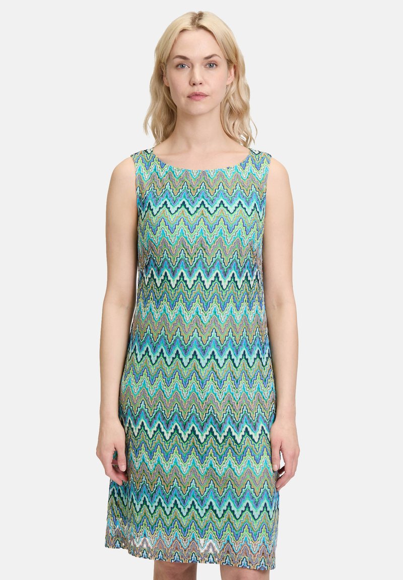 Robe sans manches avec un motif zigzag bleu et vert, dotée d'un col rond et d'une silhouette droite, fabriquée en tissu léger.