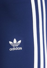 adidas Originals FLARED - Leggings - Calças - dark blue