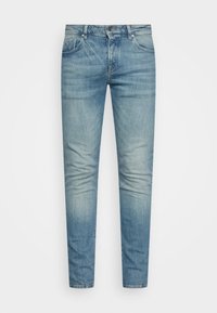 Lichtblauwe denim jeans met een slim fit. Beschikt over vijf zakken, een knoop- en ritssluiting, en subtiele vervagingen in de stof.