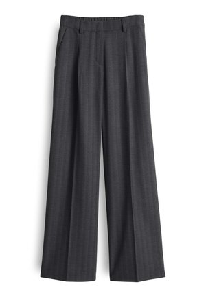 Pantalons larges en tissu gris foncé, avec un motif à rayures discrètes, des poches avant et une taille ajustée pour un look structuré.