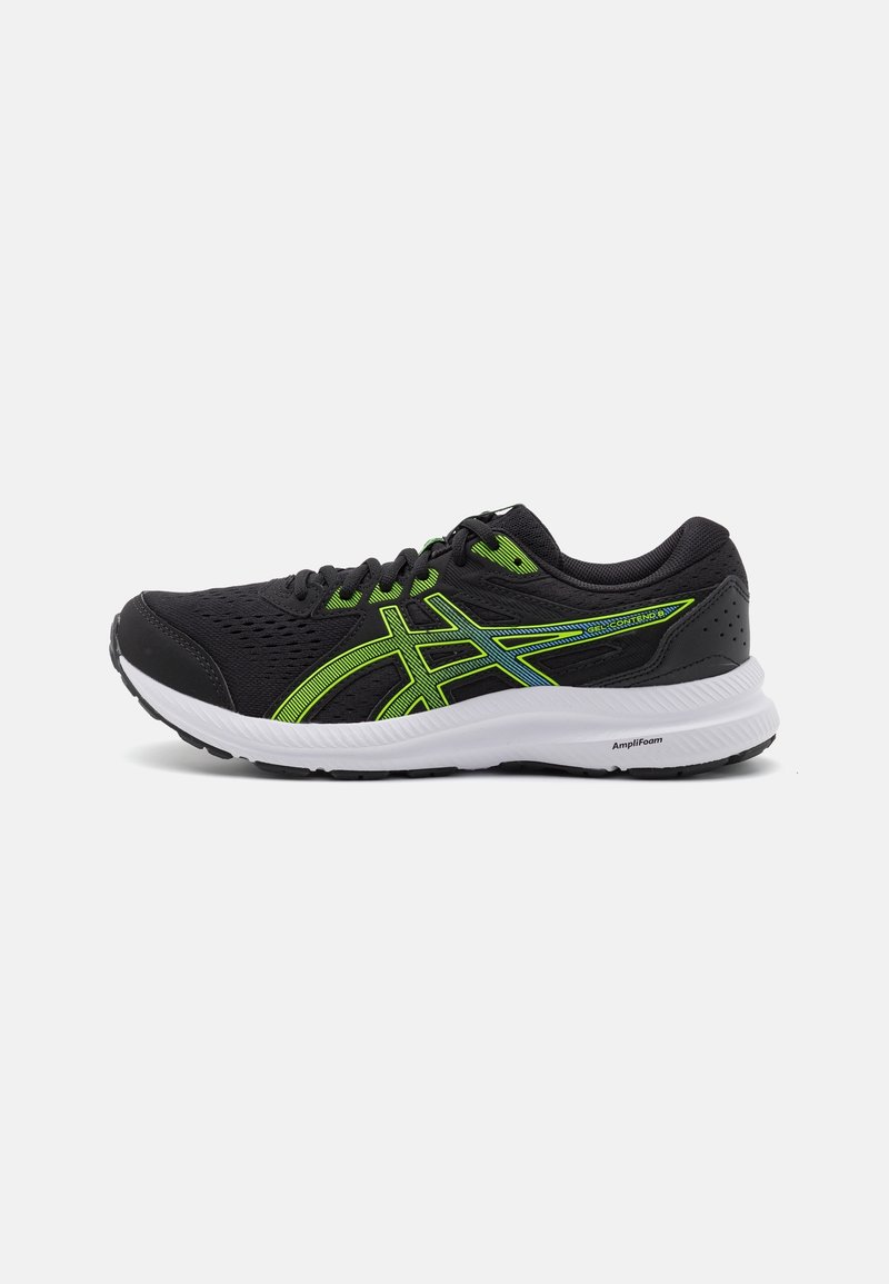Baskets de course noires et vert fluo avec semelle blanche, tige en mesh et logo de marque sur le côté, conçues pour la performance athlétique.