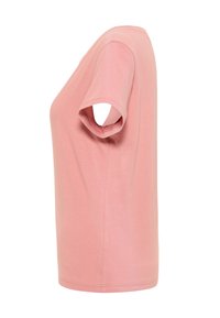 Camiseta de algodón rosa con mangas cortas, escote redondo y un corte relajado. Textura suave con color sólido y sin patrones ni adornos.