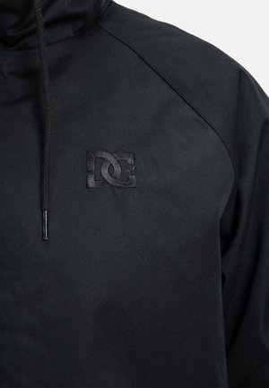 Black hoodie featuring a textured fabric, a drawstring hood, and an embossed DC logo on the chest for branding.