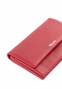 Red leather wallet with a textured surface, flap closure, and embossed logo. Compact rectangular shape with clean lines and subtly stitched edges.