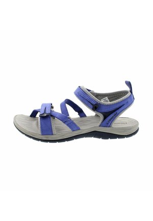 Sandali viola con cinturini e chiusure in Velcro regolabili, soletta grigia testurizzata e suola nera con motivo, progettati per comfort e trazione.