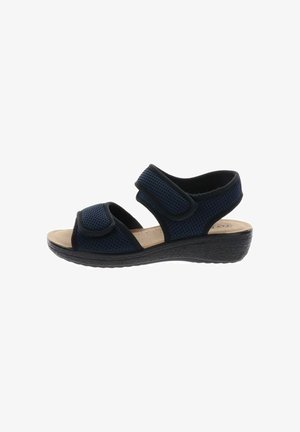 Sandalia azul marino de dedo abierto con tiras ajustables de velcro, plantilla beige acolchada y suela negra texturizada para comodidad y soporte.