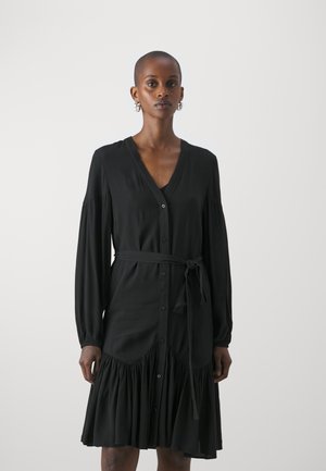 Black dress featuring a V-neck, long sleeves, and a tie belt. The design includes a ruffled skirt and buttons down the front. Smooth texture.
