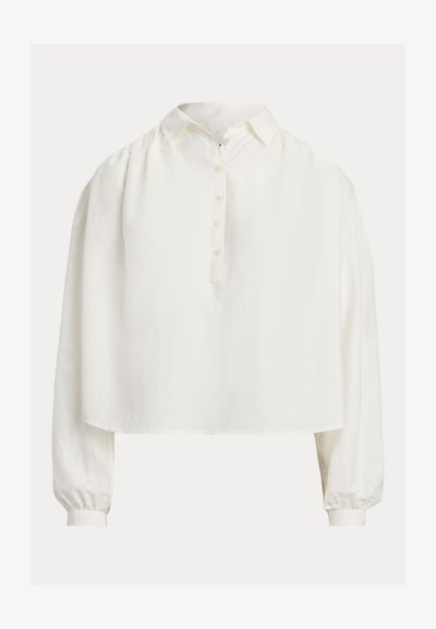Hvit knappoppskjorte med krage, kort design og lange ballongermer. Laget av mykt stoff med glatt tekstur.