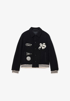 Schwarze Fleece-Varietätsjacke mit weißen gestickten Logos, gerippten Bündchen und Saum sowie einem Kragen. Mit vorderen Druckknopfverschlüssen.