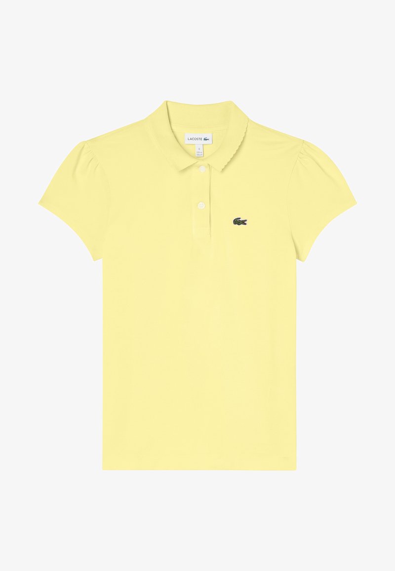 Koszulka polo w jaskrawożółtym kolorze z bawełny, z krótkimi bufkami, klasycznym kołnierzykiem, zapięciem na trzy guziki oraz zielonym haftowanym logo.