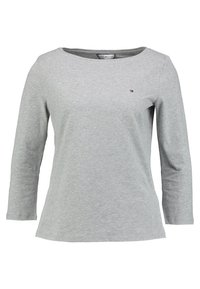 Gray long-sleeve t-shirt made of cotton. Features a boat neckline and a small logo detail on the chest. Smooth texture with a relaxed fit.