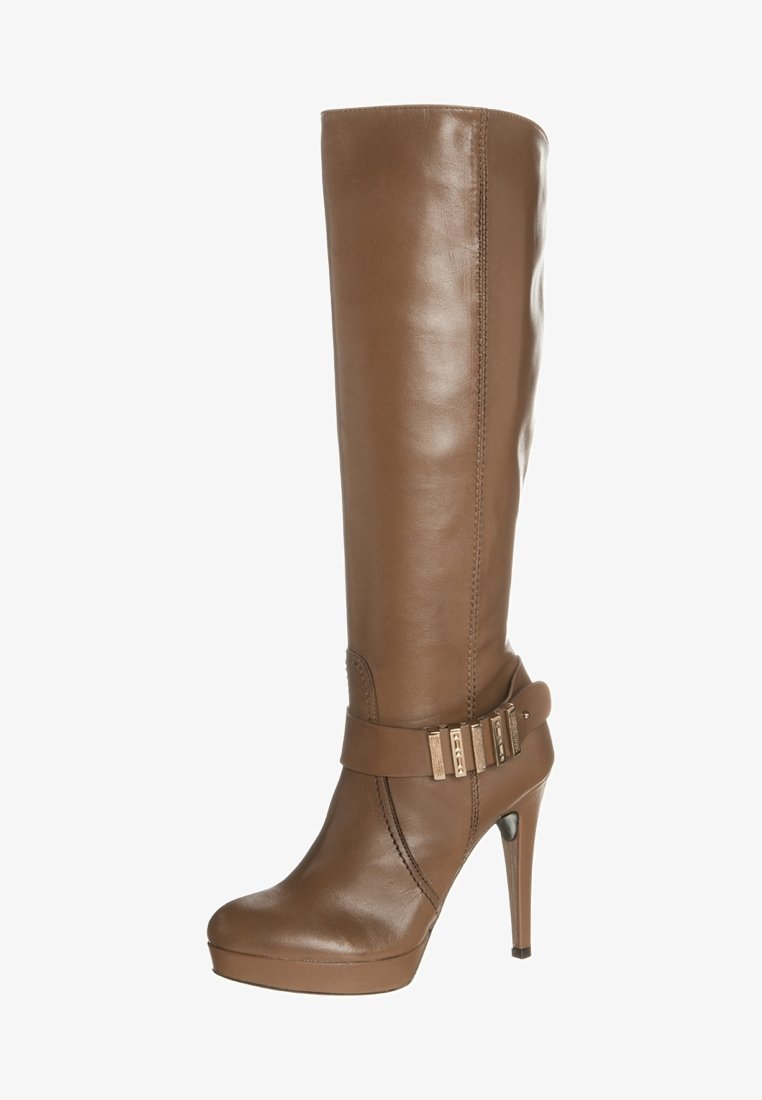 Brown leather knee-high boot with a platform heel, featuring a wide strap and metal buckle detail near the ankle. Smooth texture, sleek design.