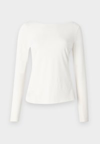 Pikendatud, õlavarrelt avatud topp pehmest valgest kangast. Omab vormitud kehaosa ja veidi laienevat alläänt. Sile tekstuur, minimalistik disain.