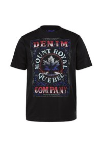 T-shirt en coton noir avec un grand graphisme portant le texte "DENIM MOUNT ROYAL QUEBEC", une feuille d'érable centrale et des accents décoratifs en rouge et bleu.